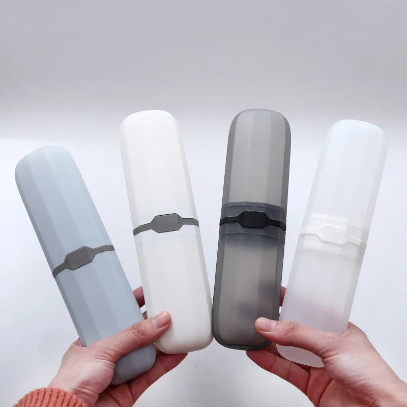 A hand holds a clear, translucent toothbrush travel case with a gray silicone cover and a white plastic cover.