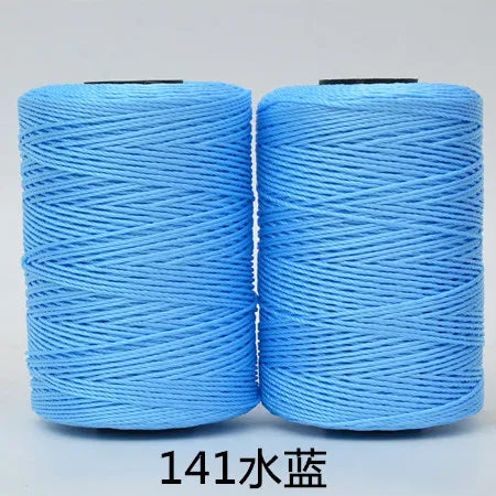 Two spools of light blue 3-ply polyester knitting yarn for crochet and hand crafts