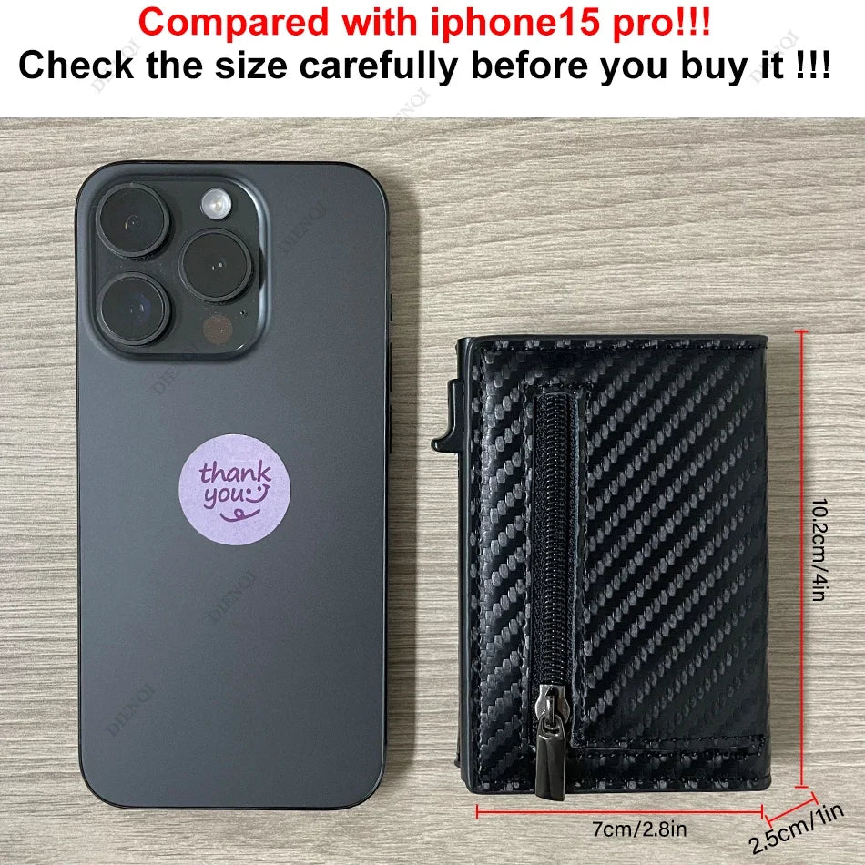 A black RFID blocking pop-up wallet is shown next to an iPhone 15 Pro to demonstrate size comparison.