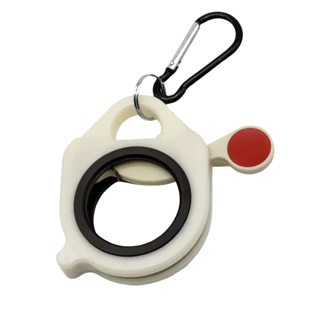 A white cable tie organizer with a black ring and a red plastic clip attached to a metal carabiner.