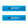 A pair of bright blue soft car seat belt cushions with white and black Sport branding.