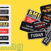 A collection of black and yellow embroidered iron-on letter patches for DIY clothing customization.