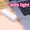 A clear plastic keychain featuring white LED mechanical keycaps attached to a silver chain.