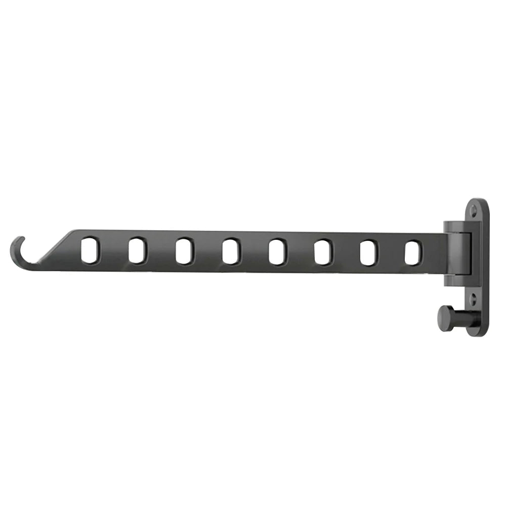 A black wall-mounted foldable clothes drying rack with multiple holes for hanging laundry.