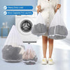 A person holds two large mesh laundry bags while a washing machine is visible in the background.