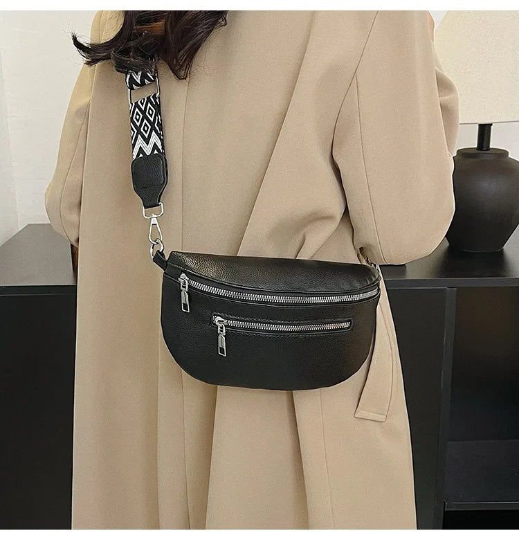 A black multi-pocket PU leather waist bag with an adjustable strap is shown hanging from a beige coat.