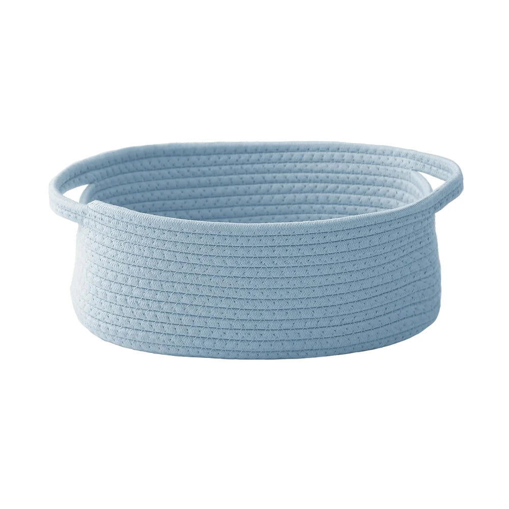 Light blue handwoven rope storage basket with handles