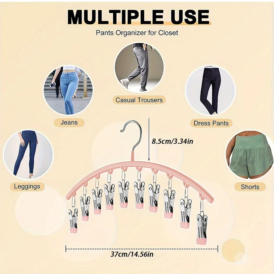 A pink hanger with multiple clips is shown organizing various types of pants like jeans, dress pants, leggings, and shorts fo