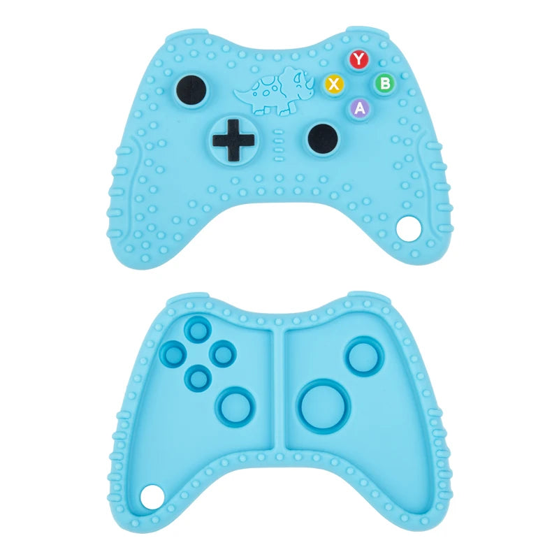 A light blue silicone baby teether toy shaped like a remote control, featuring buttons and holes.