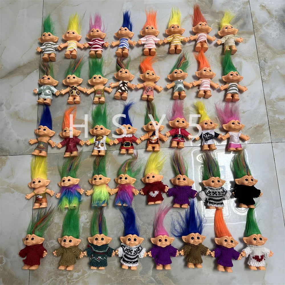 A collection of handcrafted troll doll figurines in various colors and styles arranged in a grid.