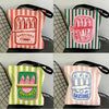 A set of four canvas tote bags featuring various designs and colors with sardine themes.