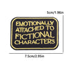 Black embroidered iron-on patch with yellow text that reads Emotionally Attached to Fictional Characters