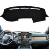 Black custom-fit dash cover for a Dodge Ram truck interior.