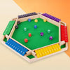 A wooden shut the box dice game with a green board and colored dice arranged in compartments.