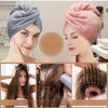 Close-up of a woman wearing a pink microfiber hair towel wrap, demonstrating its use for drying hair.