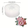 White silicone mold shaped like a flower for chocolates, candy, and fondant.