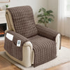 A brown quilted recliner sofa cover with side pockets resting on a light rug.