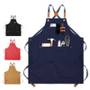 Navy blue professional chef apron with cross-back straps and multiple tool pockets