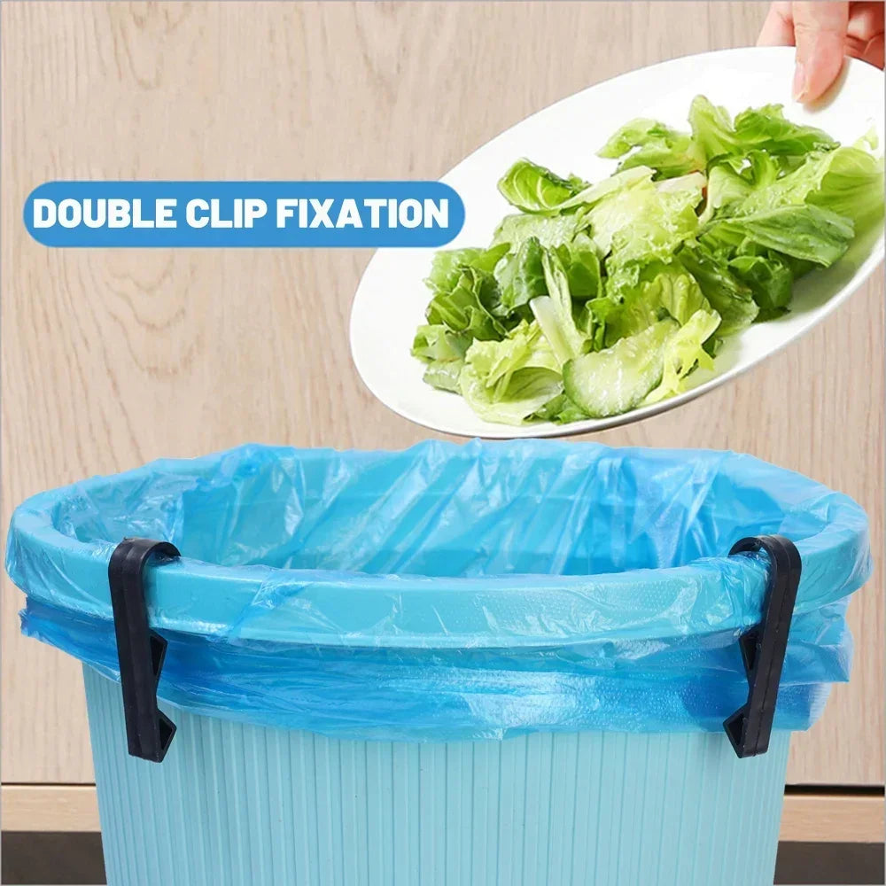 A blue plastic garbage bag holder with double clip fixation is shown next to a plate of lettuce.