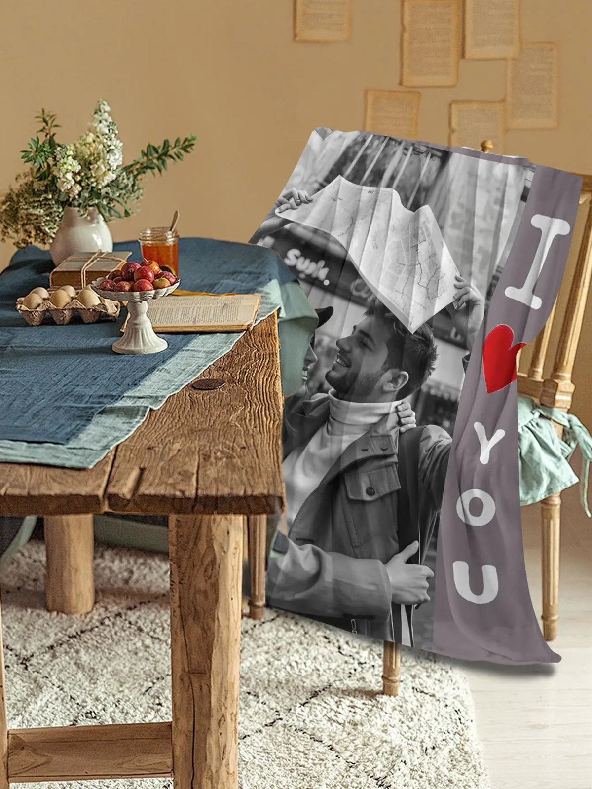 A custom photo flannel blanket featuring a black and white photo of a man smiling.