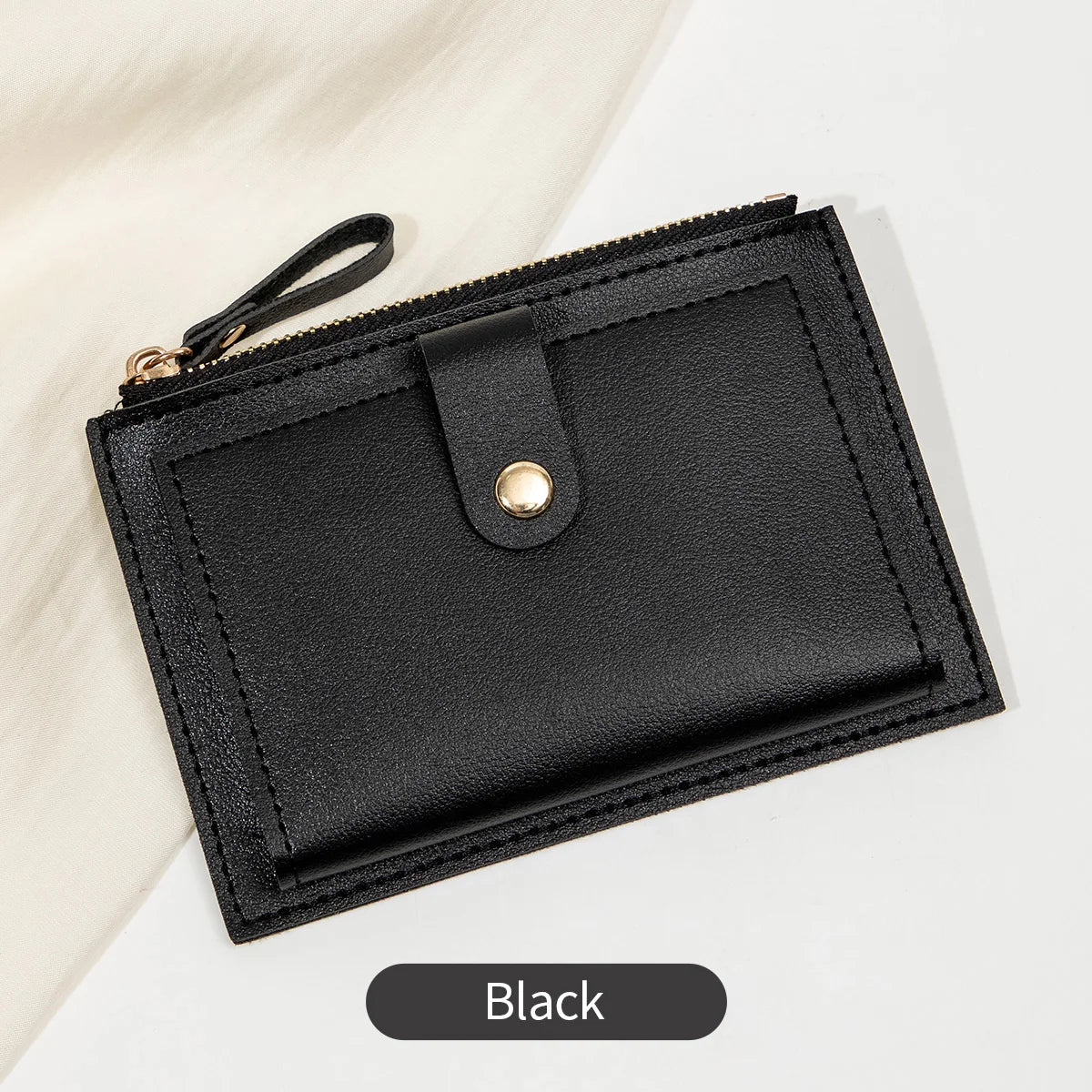 A black slim PU leather card holder wallet with a flap closure is shown against a white background.