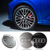 Close-up view of an Audi center hub cap decorative wheel cover and its mounting hardware.