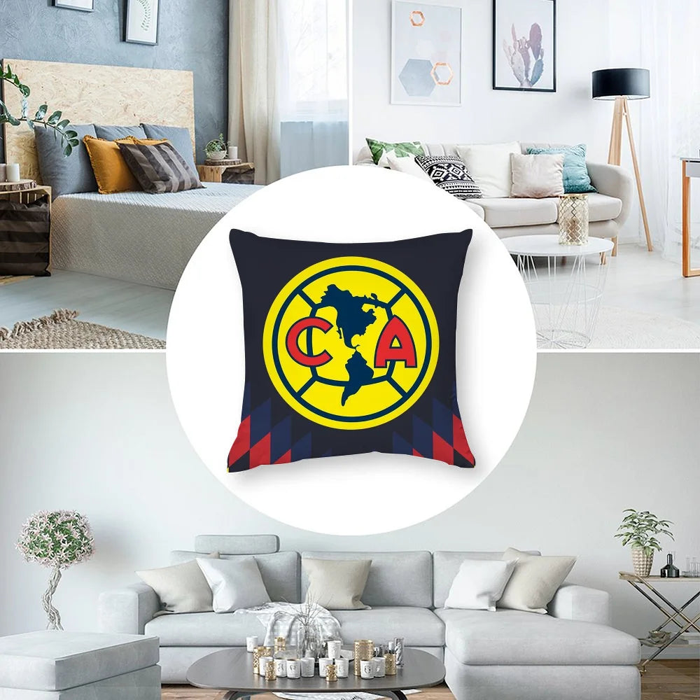 A decorative pillow featuring the Club America logo in yellow and black on a dark background.