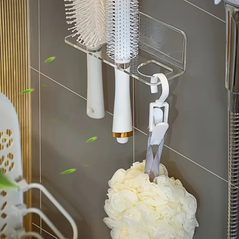 Wall-mounted acrylic organizer holding white hairbrushes and combs on a gray tiled wall.