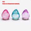 Three squishy stress cubes with pink, blue, and purple colors are displayed on a white background.
