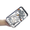A clear magnetic parts tray filled with various hardware and small metal components.