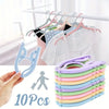 A set of ten light colored foldable travel clothes hangers with anti-slip grips are displayed next to a hand and a person ico