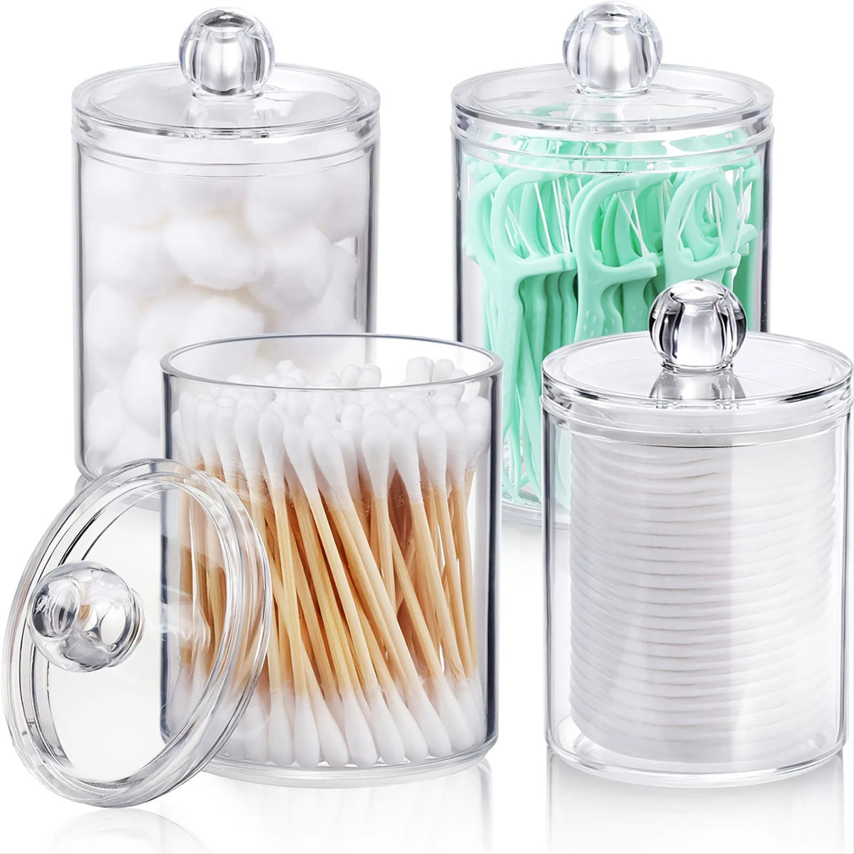 A set of clear storage jars with lids containing various swabs, tools, and beauty items.