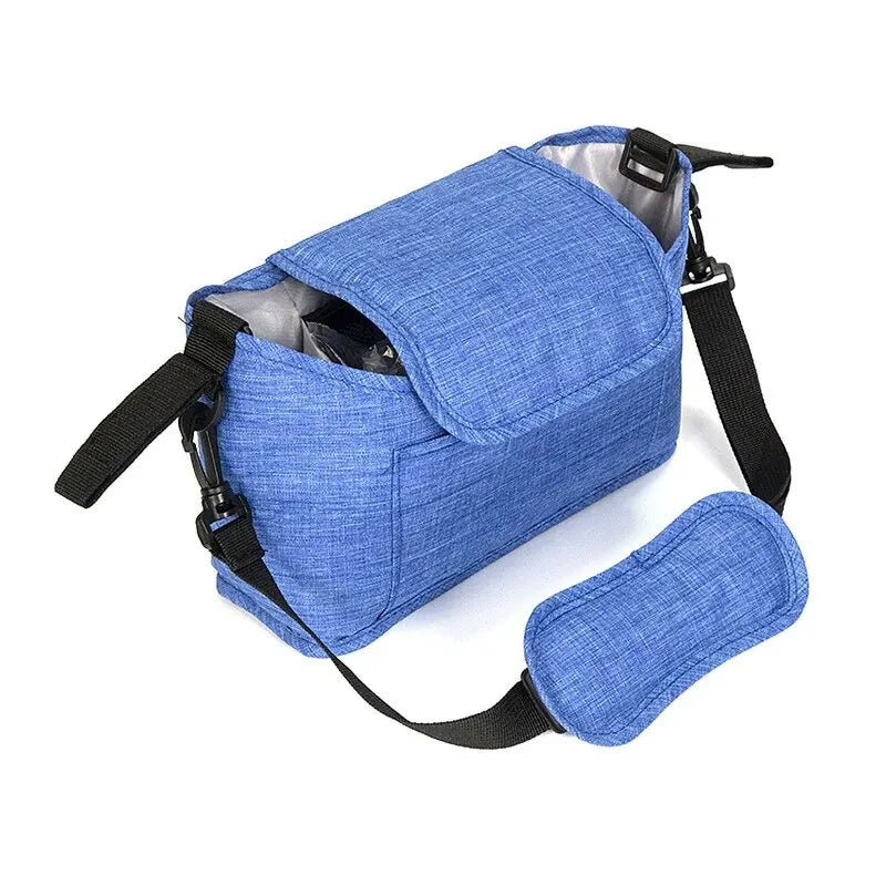 A blue stroller organizer bag with a cup holder and black straps.
