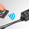 A hand holds a remote control connected by wires to a black LED music car interior light kit controller.