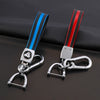 A pair of TPU leather car key covers with keychain featuring black, blue, and red stripes.