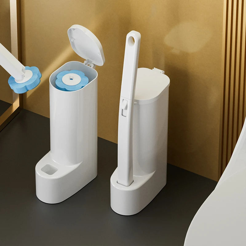 A white disposable toilet brush set with a replaceable head is shown standing on a dark surface.