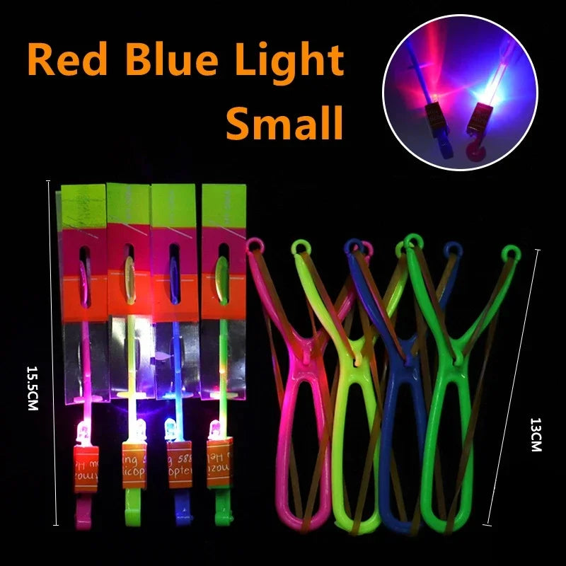 A collection of small red and blue LED glowing flying arrow toys with rubber band launchers.
