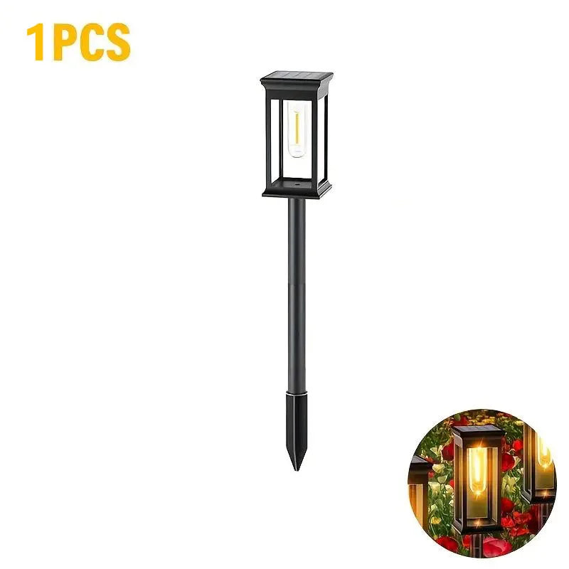 A black solar path light fixture with a yellow glow, designed for waterproof outdoor landscape lighting.