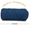 A skein of dark blue thick polyester blend yarn for knitting and crochet.