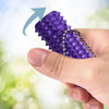 A hand holds a purple mini spiky fidget keychain with a silver chain, showing its texture and design.