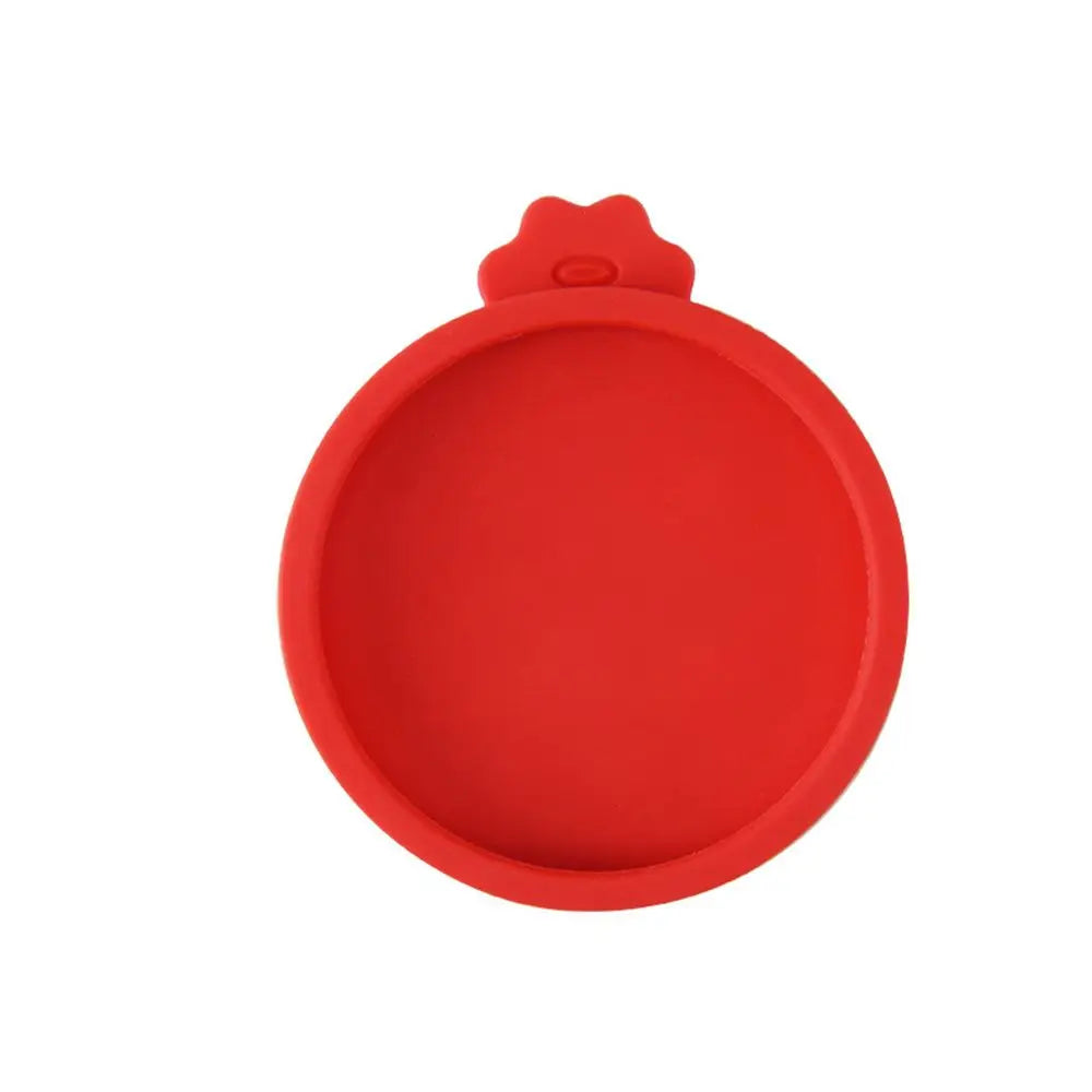 A red reusable silicone food storage lid with a rounded shape.
