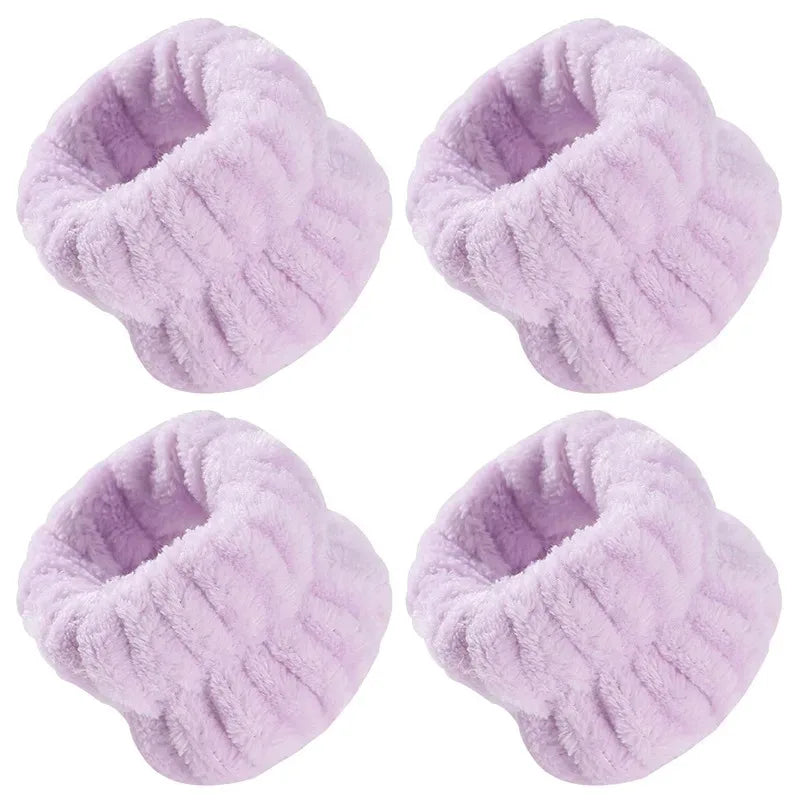 Four light purple microfiber wrist washing bands or face-saving cuffs shown from different angles.