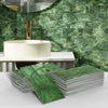 Stacks of green marble self-adhesive wall stickers used as 3D tile decals in a bathroom setting.