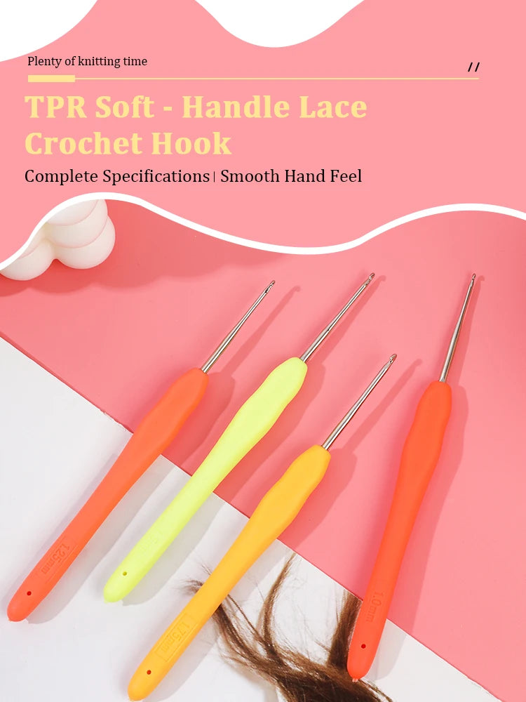A set of four TPR soft handle lace crochet hooks in orange and yellow colors displayed on a pink background.