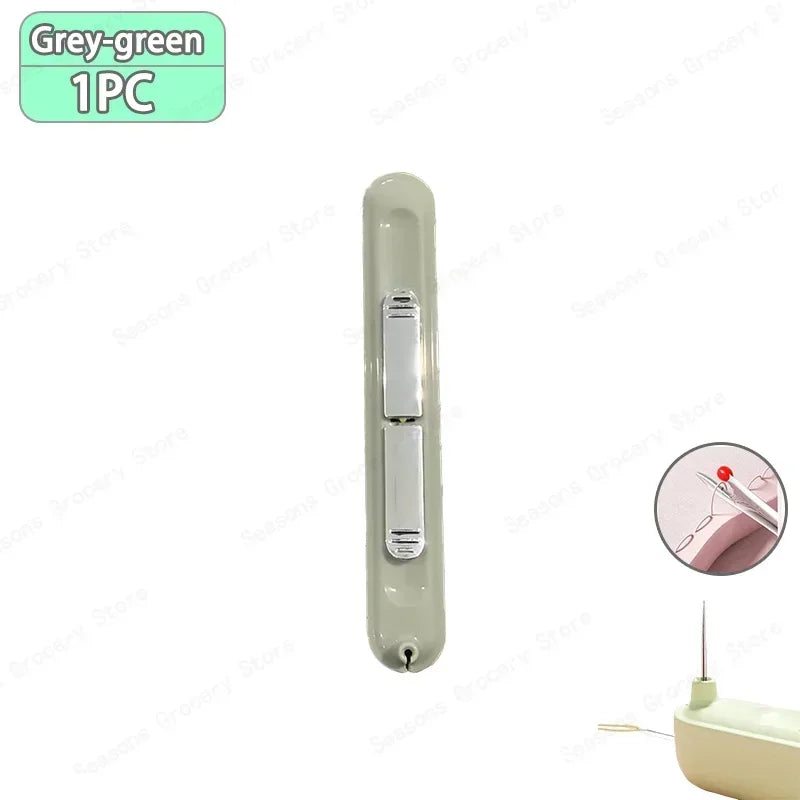 A grey-green 1 piece needle threader and seam ripper tool with a sliding mechanism.