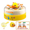 A cake decorated with ducks and friends, accompanied by a yellow egg scoop and duck eggs.
