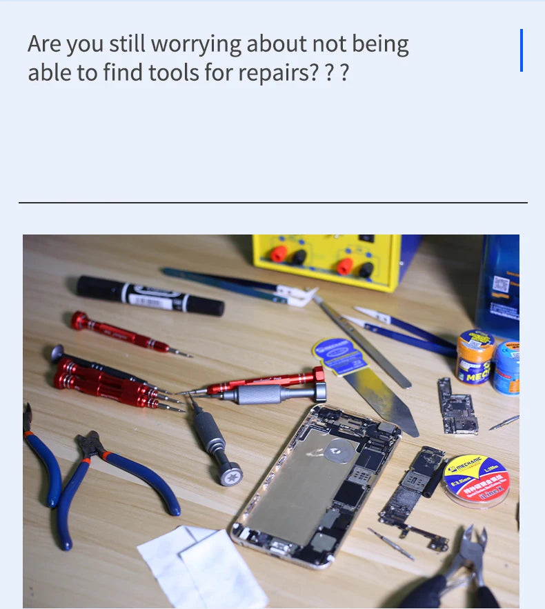 A collection of various repair tools, including screwdrivers, pliers, and knives, laid out on a wooden surface.