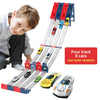 A wooden track set for racing cars with eight die-cast cars and a boy demonstrating the product.