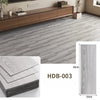 Grey wood grain floor tiles showing a rectangular tile and its thickness.
