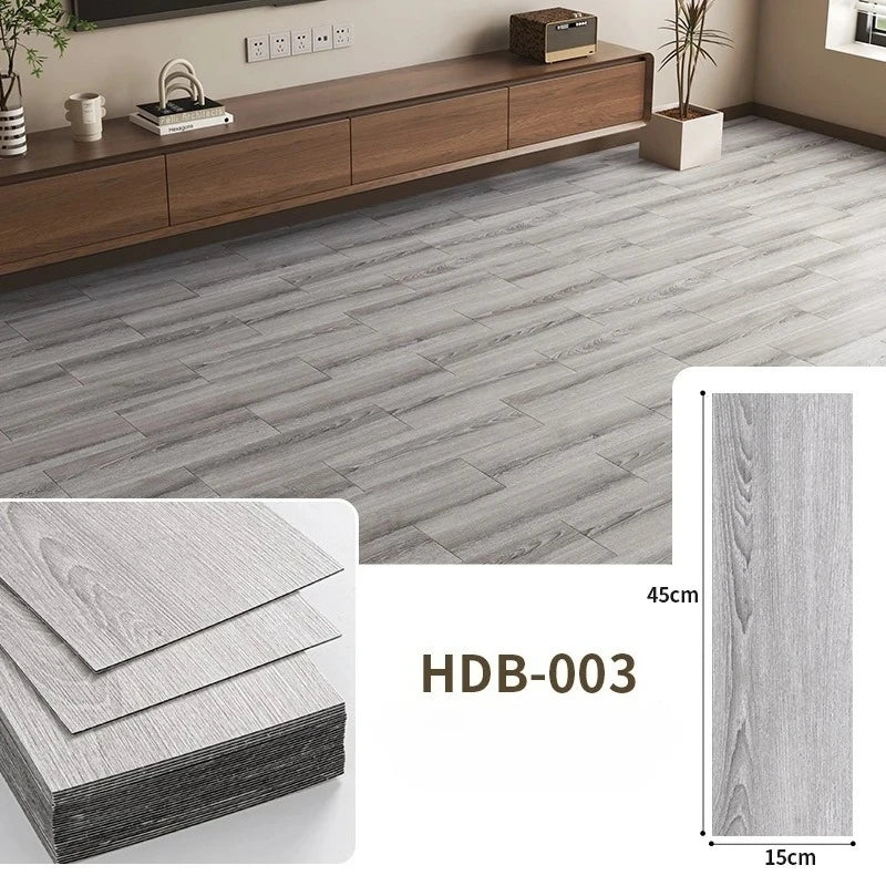 Grey wood grain floor tiles showing a rectangular tile and its thickness.